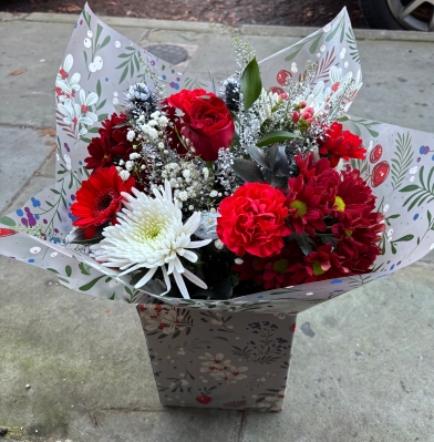 Festive charm hand tied