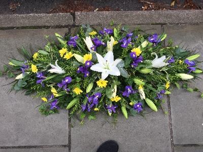 Lily and Iris casket spray