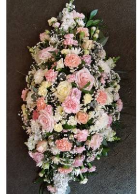 Pretty pink and cream casket spray