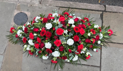 Red and white casket spray