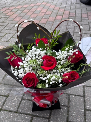 Red rose heart hand tied