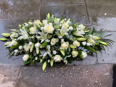 Rose, lily and lizzy casket spray