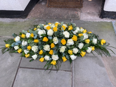 Yellow and white rose casket spray