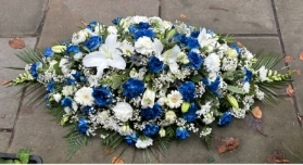 Blue and white casket spray