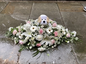 Casket spray with teddy