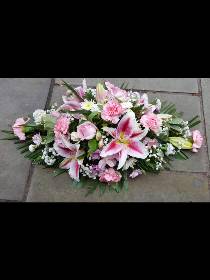 Pink and white casket spray