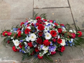 Red white and blue casket spray