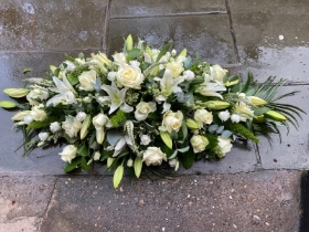 Rose, lily and lizzy casket spray