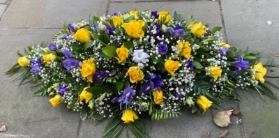 Rose iris and freesia casket spray