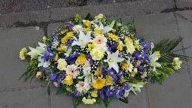 Yellow and blue casket spray